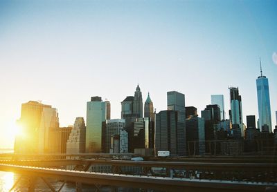 Modern buildings in city against clear sky