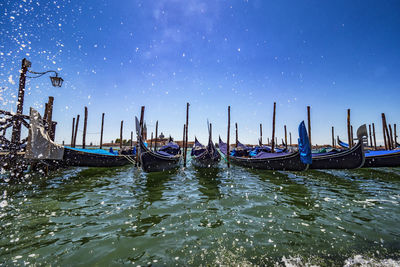 Boats moored in sea