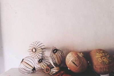 Close-up of damaged lanterns on table at home