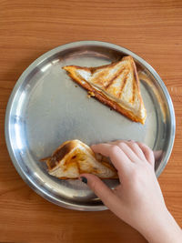 Midsection of man eating food