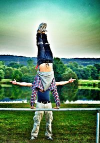 Man standing on lakeshore