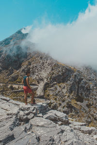 Young man standing on mountain