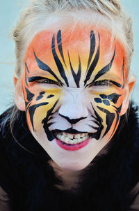 Close-up portrait of girl with face paint