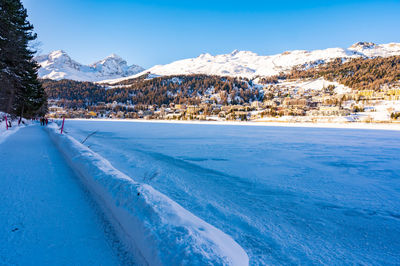 The town and lake of santk moritz in winter. engadin, switzerland.