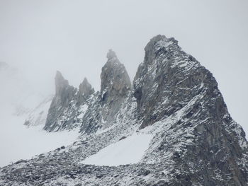 View of rocky mountains against clear sky