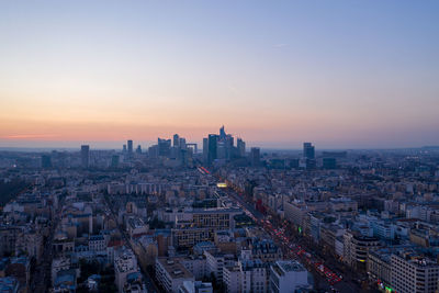 High angle view of city buildings during sunset