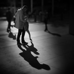 Full length of woman standing on street