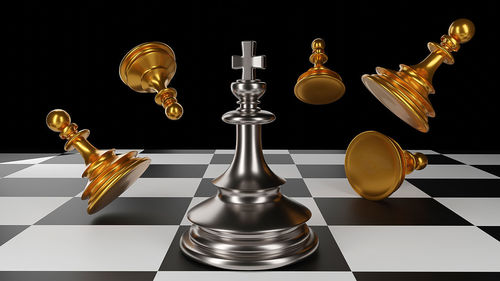 Digital composite image of chess pieces against black background