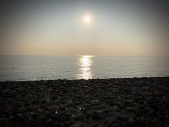 Scenic view of sea against clear sky during sunset