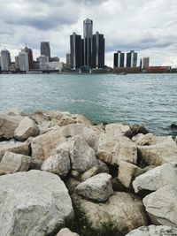 View of calm sea with buildings in background