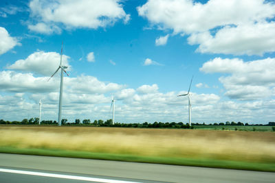 Wind turbines on field