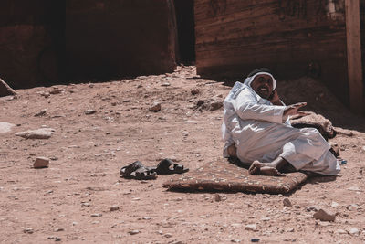 Man sitting on land