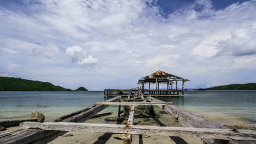 Pier over sea against sky