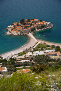 High angle view of buildings by sea