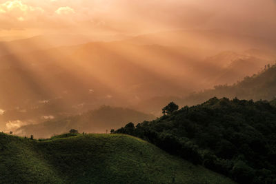 Scenic view of landscape against sky during sunset