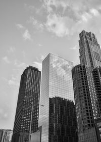 Low angle view of modern buildings against sky in city