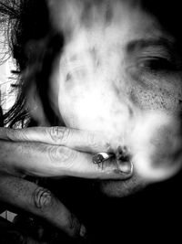 Close-up of woman smoking cigarette