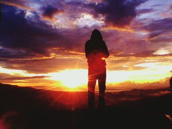 Silhouette of people at sunset