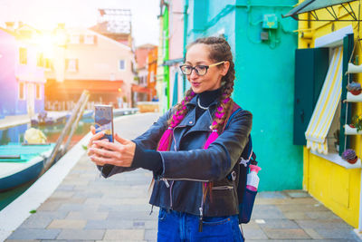 Young woman using mobile phone