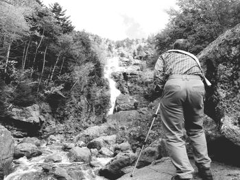 Full length of woman standing on rock