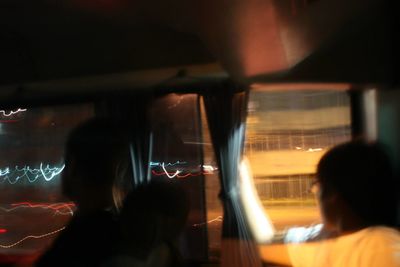 Blurred motion of woman at night