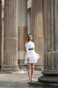 Full length of woman standing in city