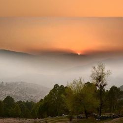 Scenic view of landscape against sky during sunset