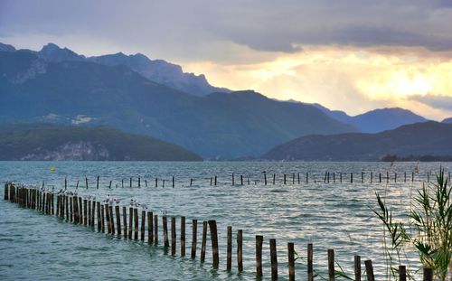 Scenic view of lake and mountains against sky