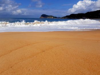 Scenic view of beach against sky