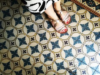 Low section of woman standing on floor