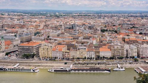 High angle view of river amidst buildings in city