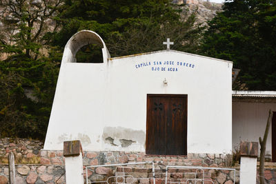 Low angle view of chapel against trees