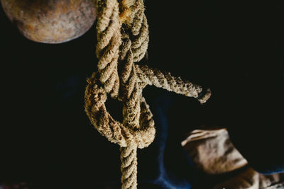 Close-up of rope tied up on metal