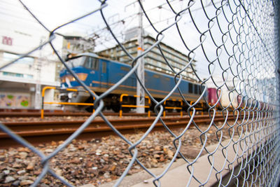 Close-up of railroad track against sky