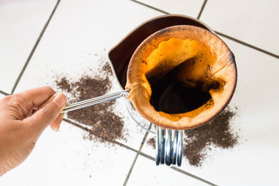 High angle view of person preparing food on table