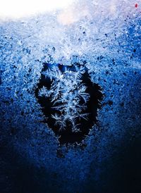 Close-up of snowflakes on window