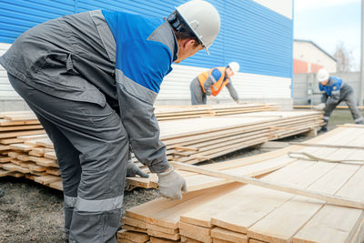 Side view of man working at construction site