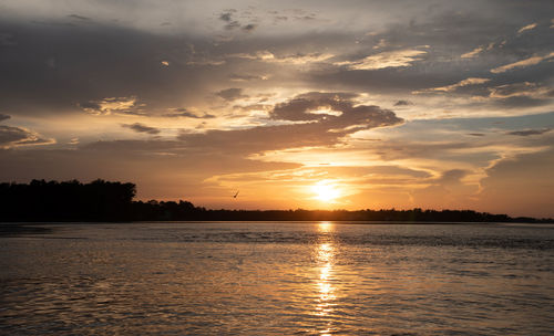 Scenic view of sea against sky during sunset