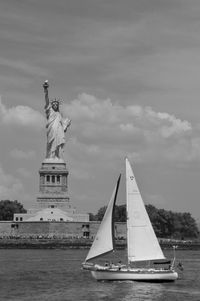 Statue of liberty against cloudy sky