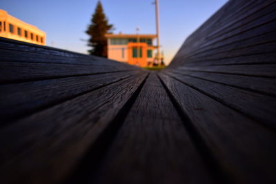 Surface level of wooden building against sky