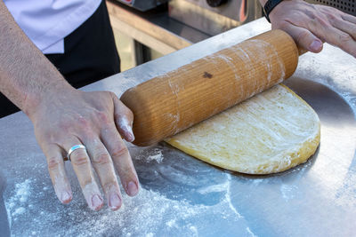 Cropped hand of person preparing food