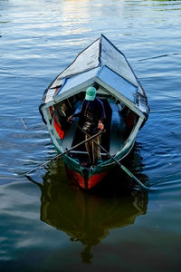 Close-up of boat floating on lake