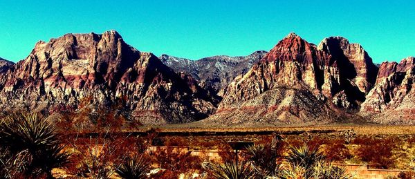 Scenic view of rocky mountains against clear sky