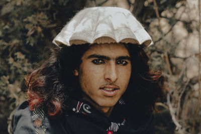 Close-up portrait of man wearing hat