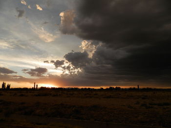 Scenic view of landscape against cloudy sky