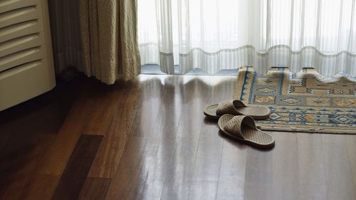 Guitar on hardwood floor at home