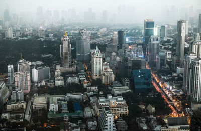 High angle view of illuminated buildings in city