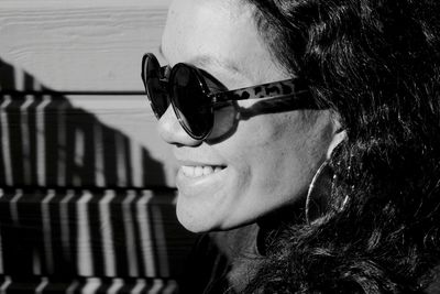 Close-up of smiling woman wearing sunglasses