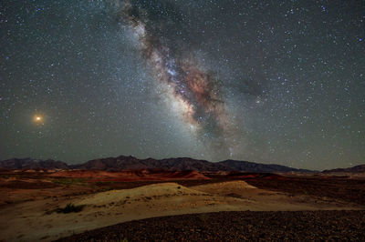 Scenic view of star field against sky at night