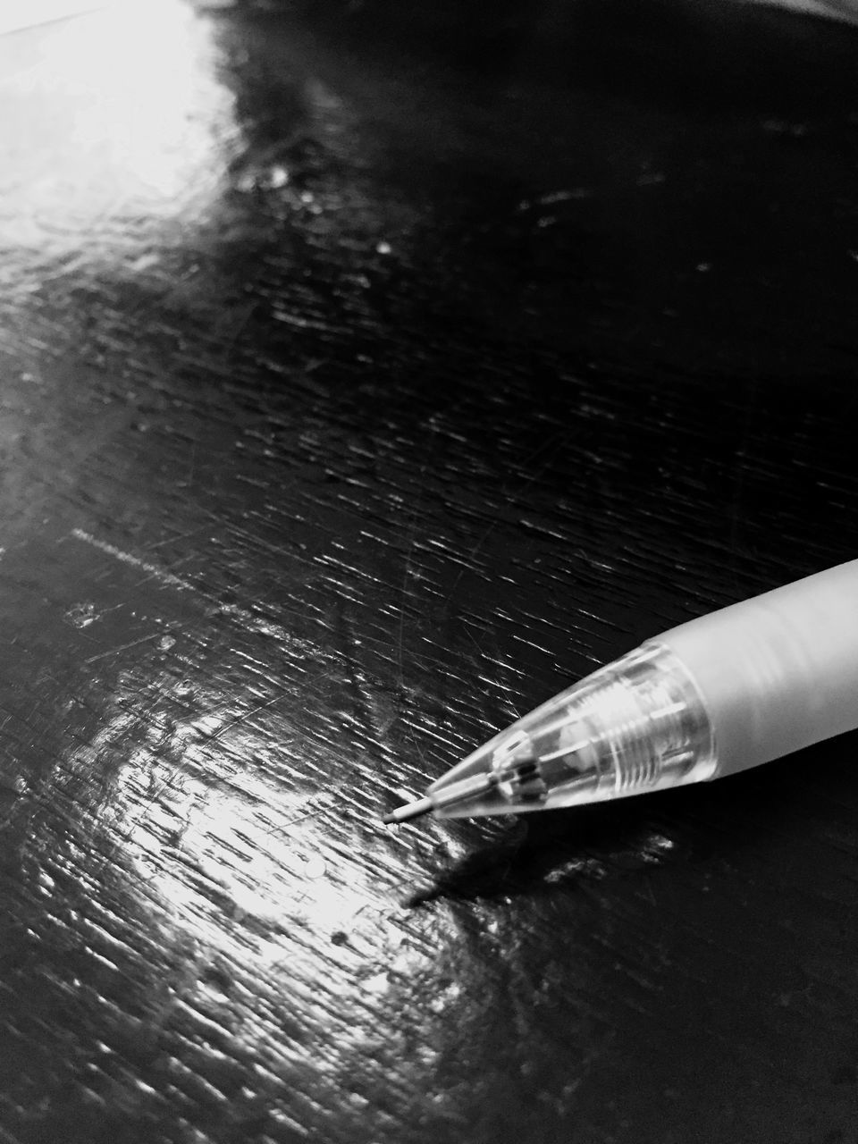 CLOSE-UP HIGH ANGLE VIEW OF CIGARETTE ON TABLE